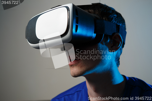 Image of Man wearing virtual reality goggles.