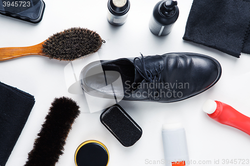 Image of Cleaning boots concept on white background