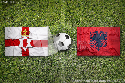 Image of Northern Ireland vs. Albania flags on soccer field