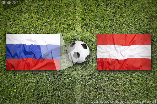 Image of Russia vs. Austria flags on soccer field