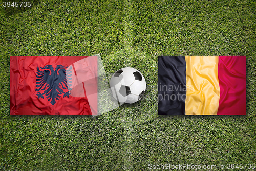 Image of Albania vs. Belgium flags on soccer field