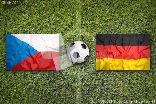Image of Czech Republic vs. Germany flags on soccer field