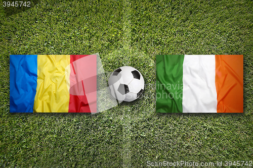 Image of Romania vs. Ireland flags on soccer field