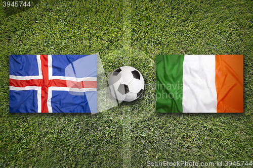 Image of Iceland vs. Ireland flags on soccer field