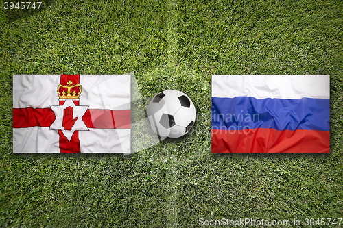 Image of Northern Ireland vs. Russia flags on soccer field