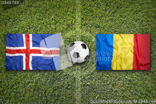 Image of Iceland vs. Romania flags on soccer field