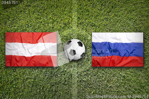 Image of Austria vs. Russia flags on soccer field