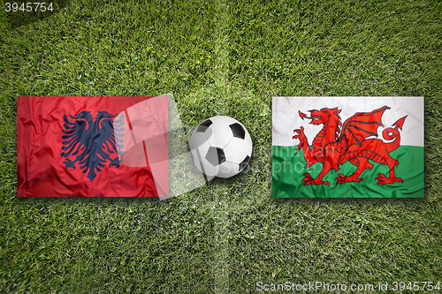 Image of Albania vs. Wales flags on soccer field