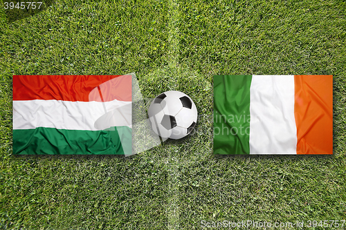 Image of Hungary vs. Ireland flags on soccer field
