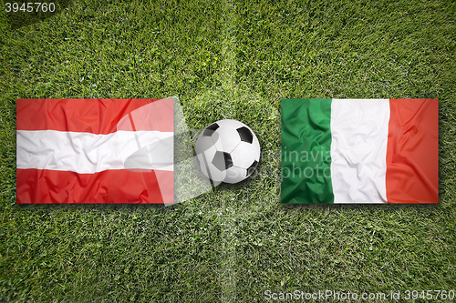 Image of Austria vs. Italy flags on soccer field