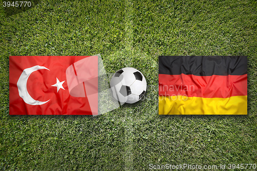 Image of Turkey vs. Germany flags on soccer field