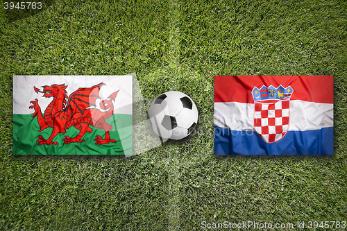 Image of Wales vs. Croatia flags on soccer field