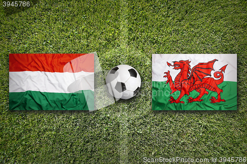 Image of Hungary vs. Wales flags on soccer field