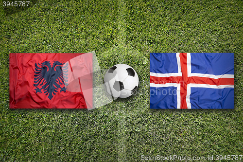 Image of Albania vs. Iceland flags on soccer field