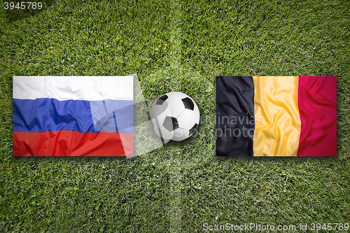 Image of Russia vs. Belgium flags on soccer field