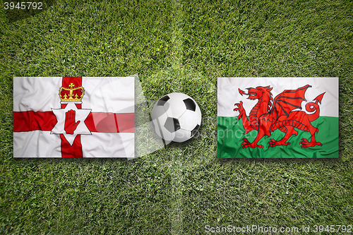 Image of Northern Ireland vs. Wales flags on soccer field