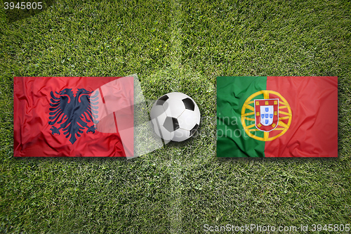 Image of Albania vs. Portugal flags on soccer field