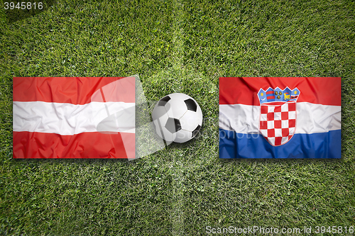 Image of Austria vs. Croatia flags on soccer field