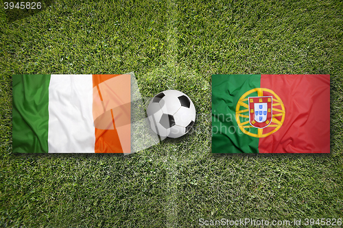 Image of Ireland vs. Portugal flags on soccer field