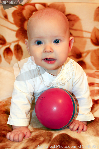 Image of little baby playing with ball