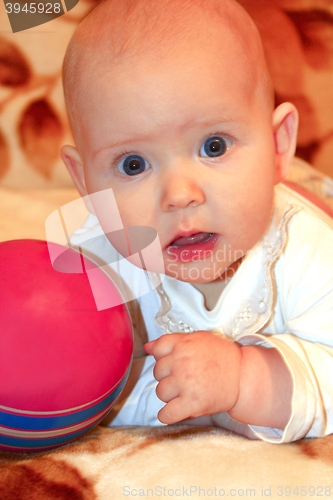 Image of little baby playing with ball