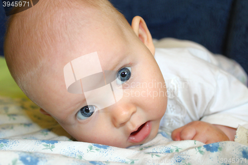 Image of little baby lying on the bed