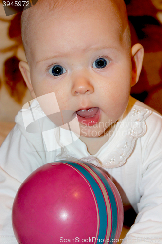 Image of little baby playing with ball