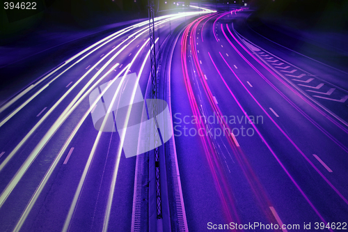 Image of cars at night with motion blur.