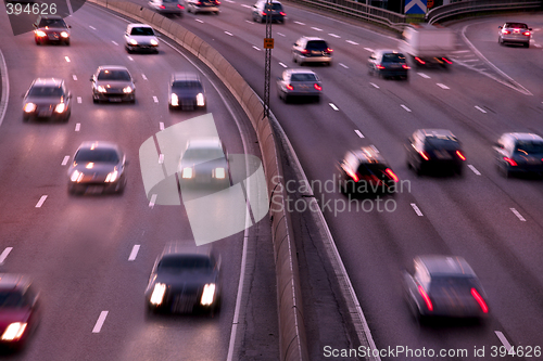 Image of cars at night with motion blur.