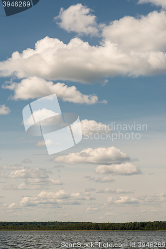 Image of Beautiful summer lake, on  background of forest and cloudy sky