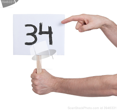 Image of Sign with a number, 34