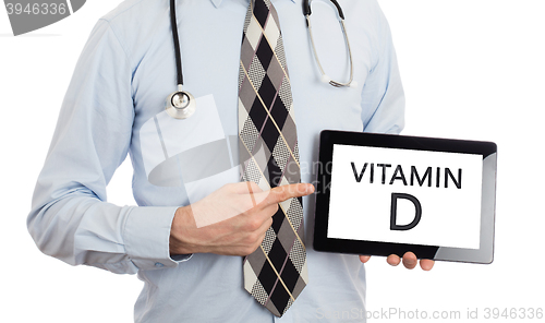 Image of Doctor holding tablet - Vitamin D