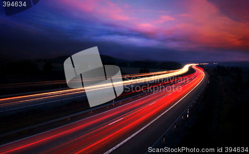 Image of cars at night with motion blur.