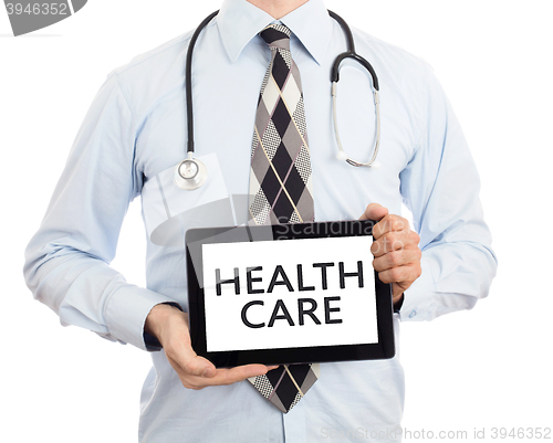 Image of Doctor holding tablet - Healthcare