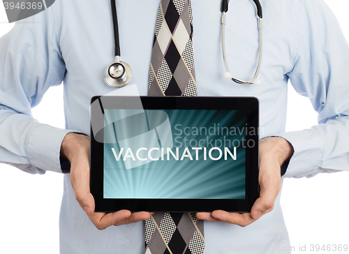 Image of Doctor holding tablet - Vaccination