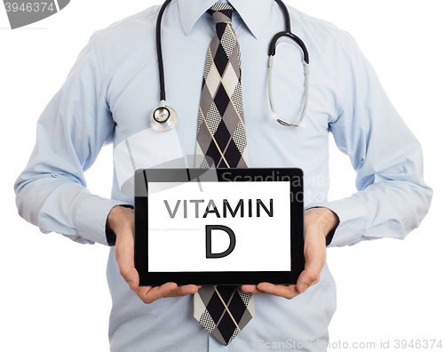 Image of Doctor holding tablet - Vitamin D