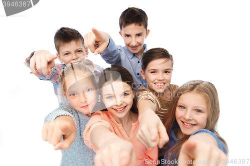Image of happy children pointing finger to you
