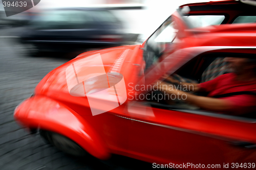 Image of Man driving fast