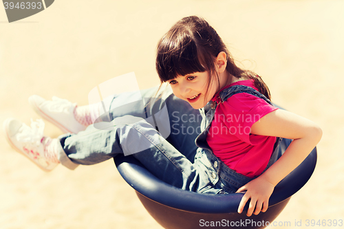 Image of happy little girl on children playground