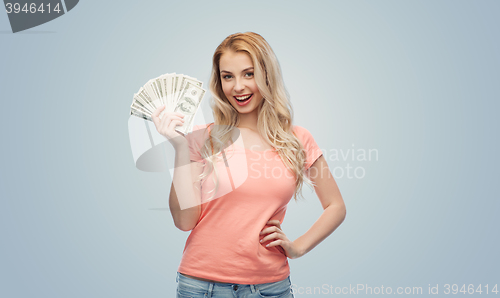 Image of happy young woman with usa dollar cash money