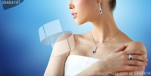 Image of beautiful woman with earring, ring and pendant