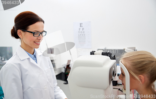 Image of optician with tonometer and patient at eye clinic