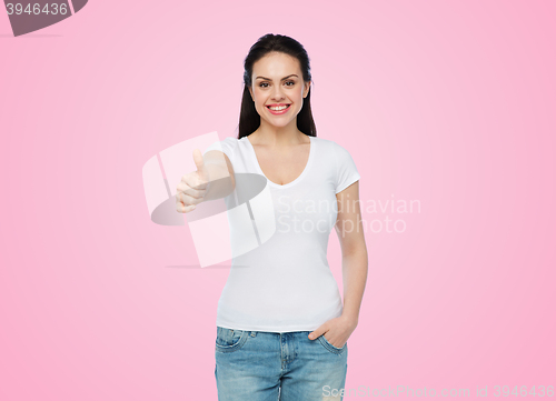 Image of happy womanin white t-shirt showing thumbs up