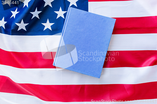 Image of close up of american flag and book