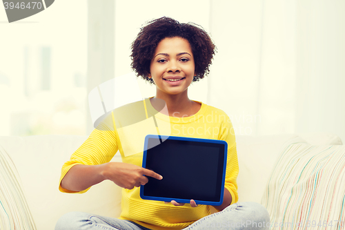 Image of happy african american woman with tablet pc