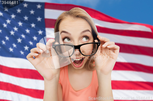 Image of happy young woman or teenage girl in eyeglasses