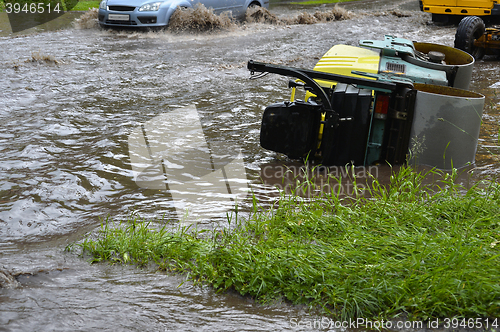 Image of Car rides in heavy rain on a flooded road