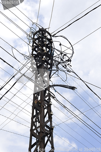 Image of Many wires on an old electric pole