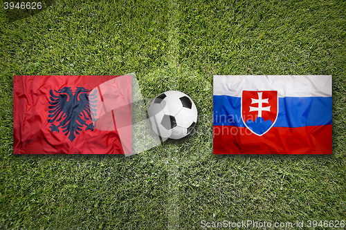 Image of Albania vs. Slovakia flags on soccer field