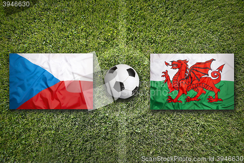 Image of Czech Republic vs. Wales flags on soccer field